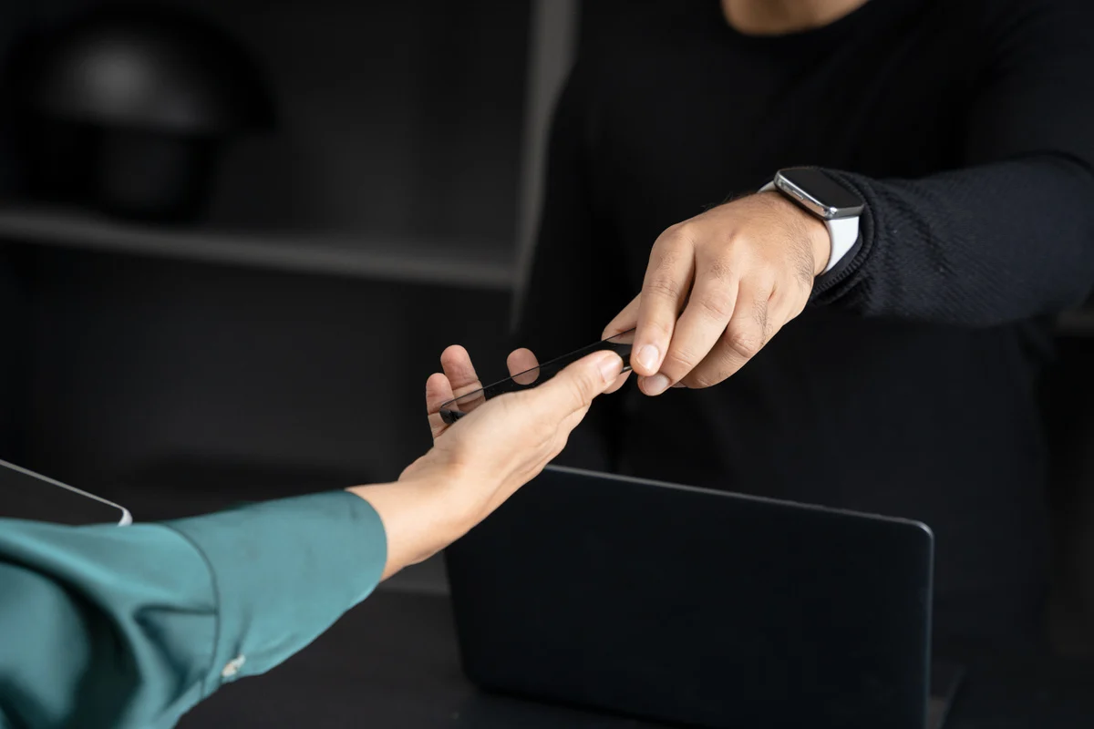 A laptop being handed back to its owner